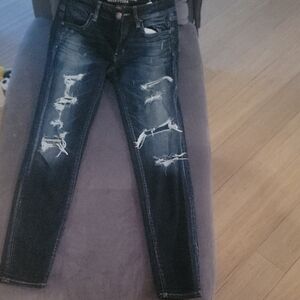 American Eagle Outfitters Dark Blue Distressed Skinny Jeans. Size 4. BNWOT.